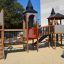 Citadel castle with slide in un contesto di parco giochi con bambini che giocano