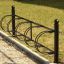 Bike Stand - rastrelliera per biciclette in metallo nero con quattro supporti circolari.