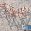 Struttura da arrampicata per parco giochi in legno Sonora su terreno sabbioso.