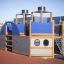 Struttura per area giochi Steamboat ship with slide con design blu e in legno su pavimentazione di sicurezza in gomma