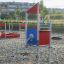 Neptune Single Playhouse nel parco giochi con superficie sabbiosa