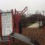 Attrezzatura fitness all'aperto Information Board NAF MEDIUM in un contesto di parco.