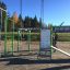 Stazione per esercizi all'aperto Information Board NAF MEDIUM con varie attrezzature da palestra e istruzioni.