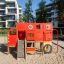 Struttura da arrampicata per parco giochi Big Truck single slide nei colori rosso e giallo.