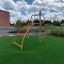 Struttura da arrampicata per parco giochi in acciaio 'Cassiopeia' con barre arancioni.