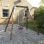 Sabbiere con Baby Single Swing in area esterna residenziale.