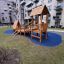 Galapagos wooden playhouse with slide situato in un complesso residenziale di appartamenti.