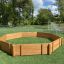 Arena da gioco ottagonale in legno per esterni, Octagon Arena I, su campo in erba artificiale con porte da calcio in