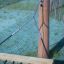 Attacco con catena e corda per Double Hammock su un palo di legno.