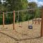 Double Robinia Swing Nature 1 + 2 (BNS 120 cm) (multiple swing) in un parco giochi con tre diversi s