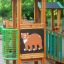 Forest Treehouse playhouse with slide struttura in legno e decorazione di un orso nel parco giochi