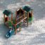 Forest Treehouse playhouse with slide su un parco giochi sabbioso con un bambino che scivola