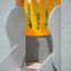 Elephant playhouse with slide con pannelli grigi e arancioni.