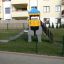 Elephant playhouse with slide in un parco giochi recintato