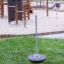 Parco giochi Spinner III su area erbosa con strutture per arrampicata sullo sfondo