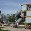 Box "Breeze" with a slide attrezzatura da parco giochi con pannelli blu e struttura in legno