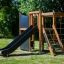 Struttura da gioco all'aperto in legno con scivolo e reti da arrampicata - Climbing Kiosk Nature.