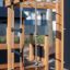 Struttura in legno per esterni Climbing Kiosk Nature con corde e scala.