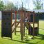 Struttura da parco giochi per esterni Climbing Kiosk Nature su un prato verde.