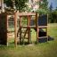 Struttura da gioco Climbing Kiosk Nature con scivolo ed elementi di arrampicata in un ambiente esterno.