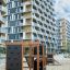 Struttura da arrampicata per parco giochi Climbing Kiosk Nature con telaio in legno e pannelli da arrampicata in un contesto urbano r