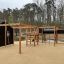 Motor Function Center Nature, wooden playhouse in un parco.
