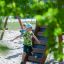 Bambini che giocano su Searobber Castle castle with slide in un parco giochi.