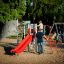 Parco giochi Whale - AZTEC steel structure con parete da arrampicata e scivolo rosso