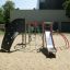 Struttura da parco giochi Whale - AZTEC steel structure con parete da arrampicata e scivolo.
