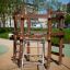 Sherwood wooden playhouse con struttura da arrampicata in un parco.