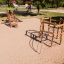 Sherwood wooden playhouse su un parco giochi sabbioso.