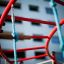 Attrezzature da parco giochi Orca steel structure con barre rosse e corde per arrampicarsi