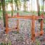 Struttura da arrampicata in legno Kongo per bambini in un parco giochi nel bosco.
