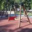 Parco giochi con Rubber Tiles 45 e altalena.