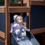 Bambini che giocano su Tower Nature wooden playhouse with slide.