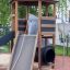 Struttura da parco giochi in legno Six Angle Aztec con scivolo ed elementi da arrampicata.