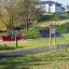 Moderna attrezzatura da parco giochi all'aperto Rules Tab in un contesto di parco.
