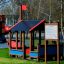 Struttura di casetta da gioco all'aperto per bambini in un parco, chiamata Rules Tab.