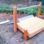 Struttura da gioco in legno con Hill Slide Wide h120 in un parco.