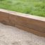 Oak Beam Section (running meter) utilizzato come bordo da giardino.