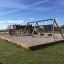Parco giochi all'aperto con altalene e struttura da arrampicata realizzata con Oak Beam Section (running meter).