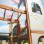 Struttura in legno Camelot castle with slide per bambini nel parco giochi