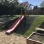 Hill Slide SL150 all'aperto in un parco giochi.