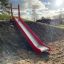 Scivolo da parco giochi Hill Slide SL210 in una giornata di sole.