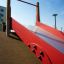Scivolo rosso Hill Slide Wide SLW120 in un parco giochi.