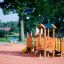 Rubik playhouse with slide in un parco giochi colorato