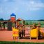 Rubik playhouse with slide in un parco giochi.