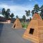 Wigwam wooden house in un cortile scolastico con alberi sullo sfondo