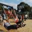 Bambini che giocano su Double Swing with Tower playhouse with slide.