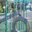 Attrezzatura da gioco Sirius steel structure con rete da arrampicata e altalena circolare